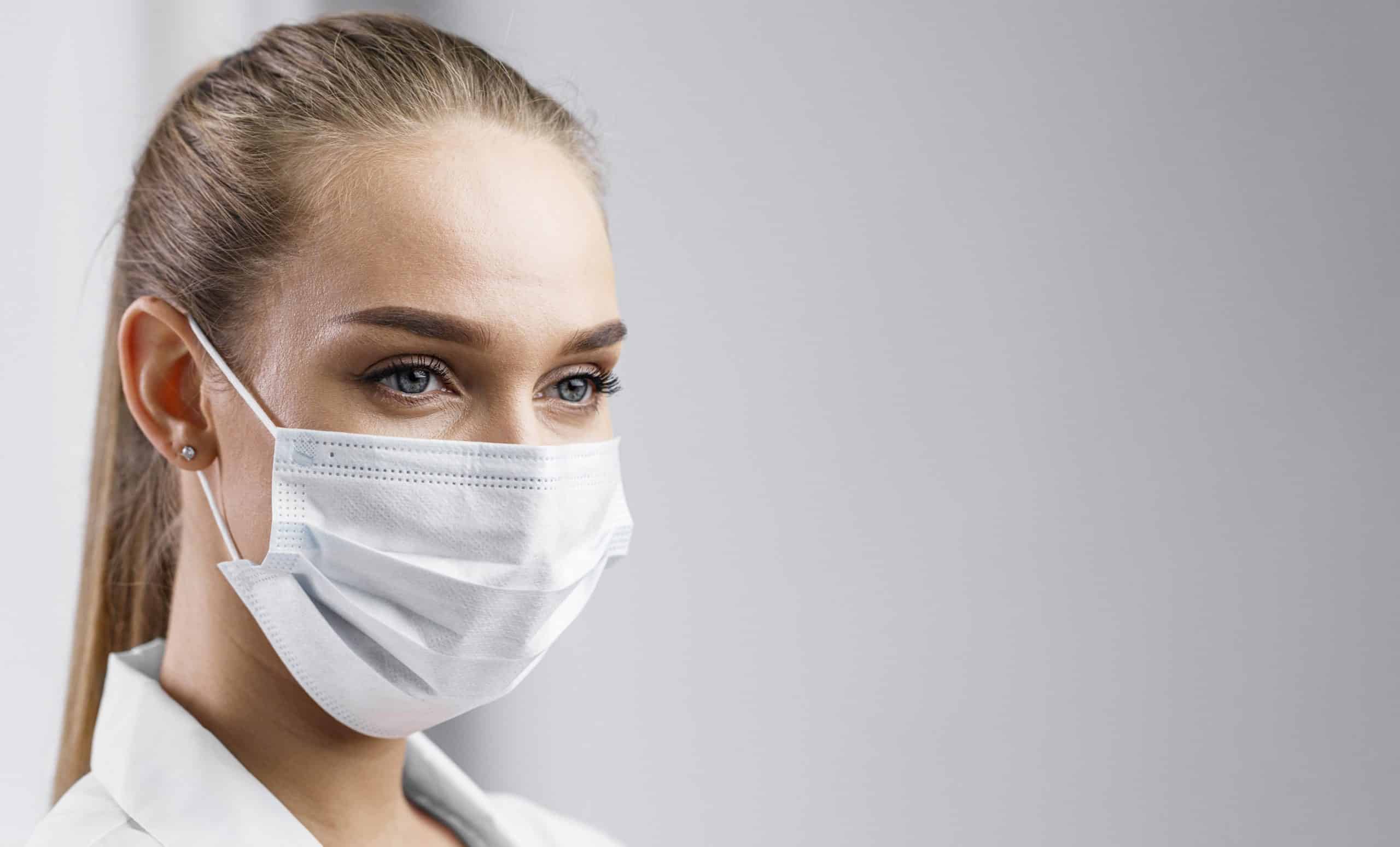 portrait-of-female-researcher-with-medical-mask-and-copy-space